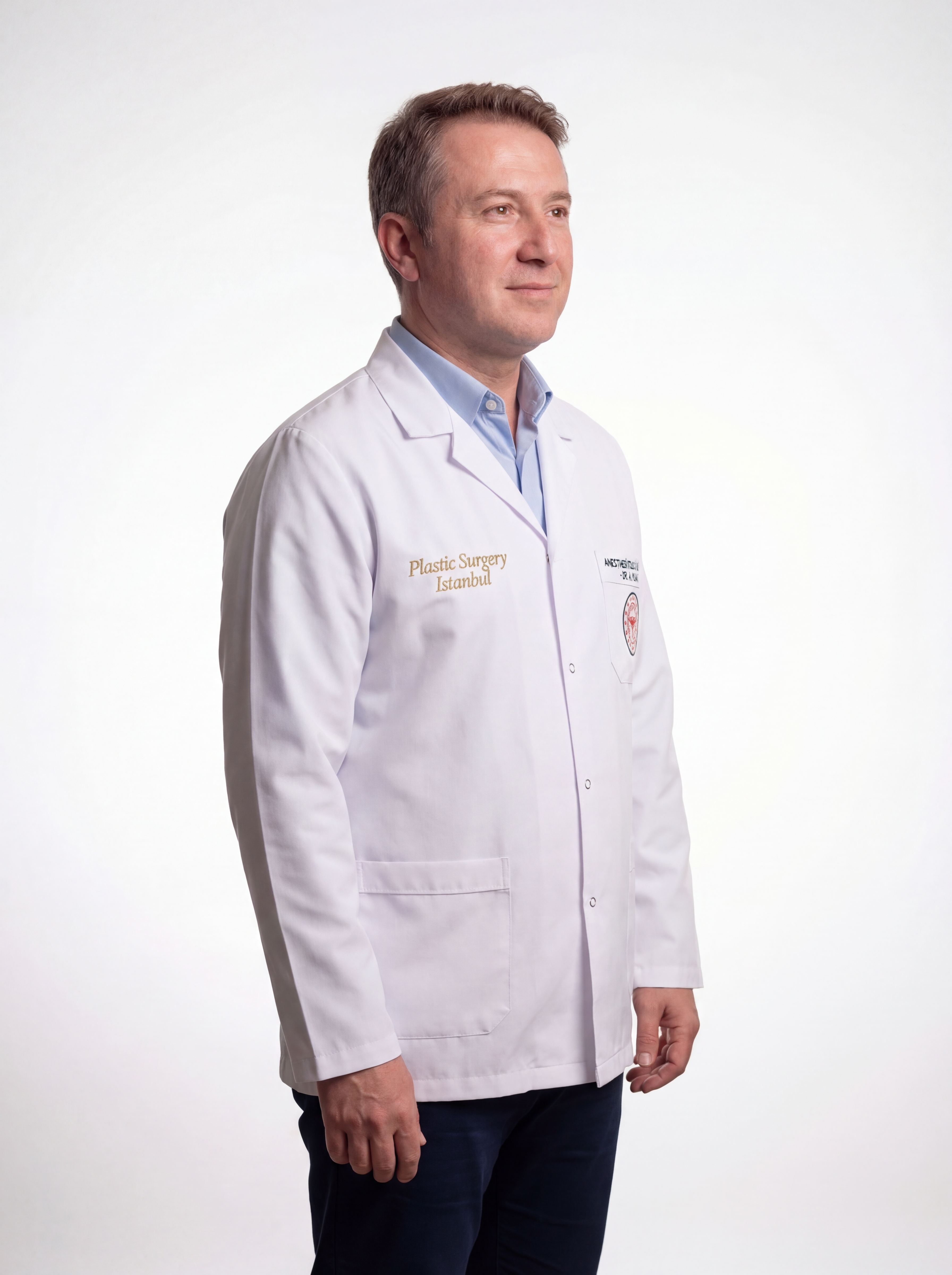 Dr. Barış Onur Yılmaz — coat (right)