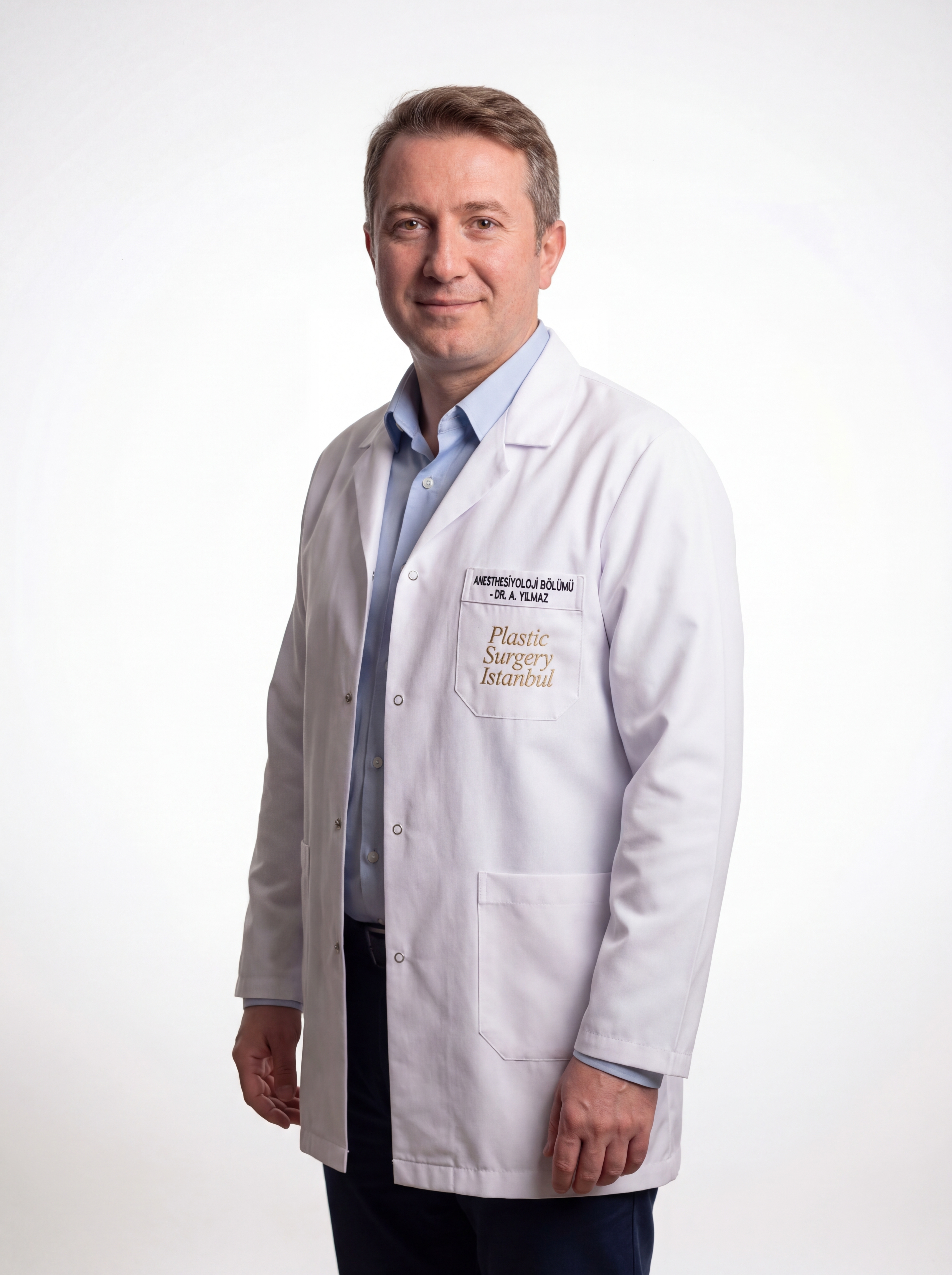 Dr. Barış Onur Yılmaz — coat (left)